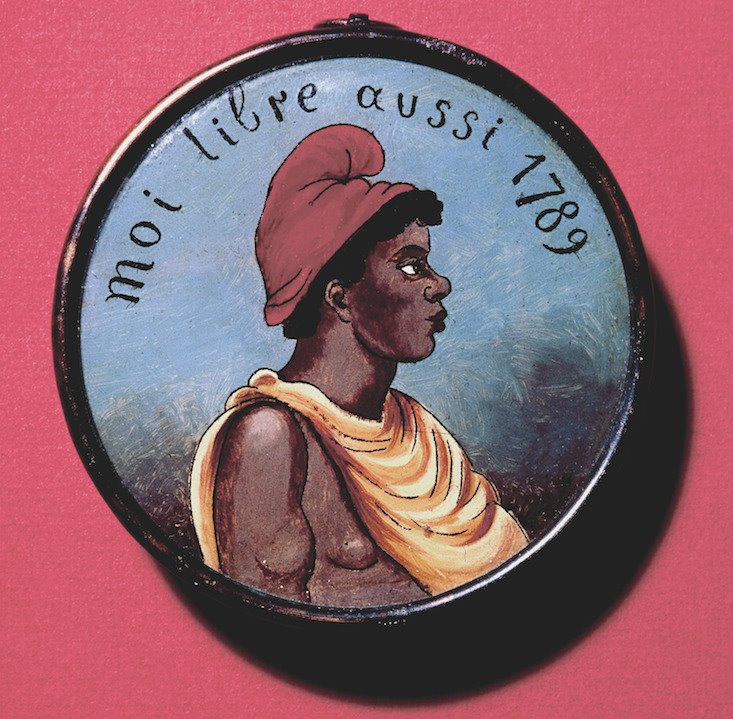 "Yo, libre también" se puede leer en este medallón pintado en el que aparece una esclava con gorro frigio.